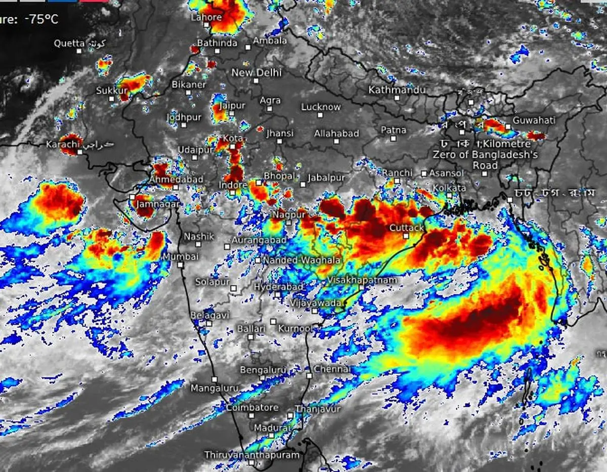 Heavy rain clouds hovered over Odisha, Chhattisgarh and East Madhya Pradesh on Tuesday afternoon under the influence of a monsoon depression over the Odisha coast.