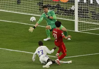 Liverpool's Andrew Robertson heads the ball during the Champions League  final soccer match between Liverpool and Real Madrid at the Stade de France  in Saint Denis near Paris, Saturday, May 28, 2022. (