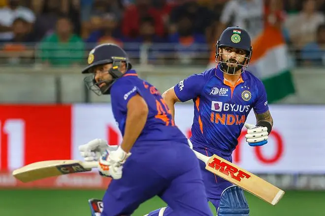 Indian batsmen Rohit Sharma and Virat Kohli run between the wickets during the Asia Cup 2022 cricket match between India and Pakistan, at Dubai International Cricket Stadium, UAE. Indian batsmen Rohit Sharma and Virat Kohli run between the wickets during the Asia Cup 2022 cricket match between India and Pakistan, at Dubai International Cricket Stadium, UAE.