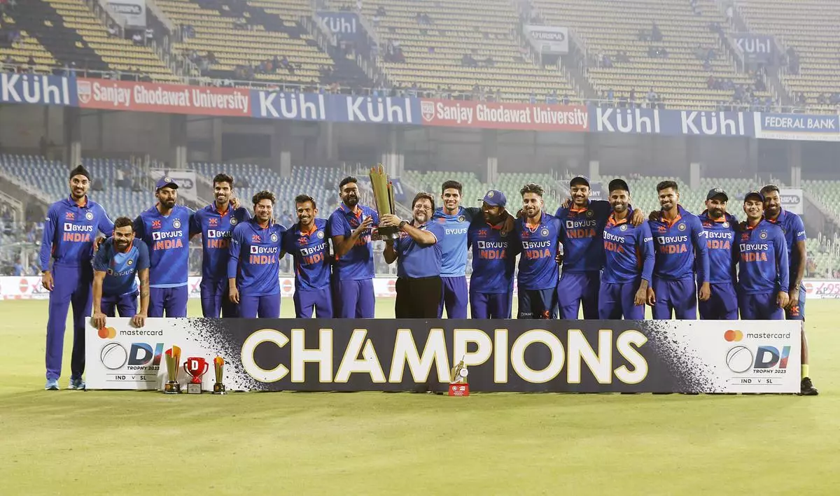 Indian team poses for a photo with the ODI trophy after winning the 3rd ODI match against Sri Lanka, at Greenfield International Stadium, in Thiruvananthapuram on Sunday. 