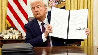 U.S. President Donald Trump holds a signed executive order on AI, in the Oval Office of the White House, in Washington, U.S., January 23, 2025.     