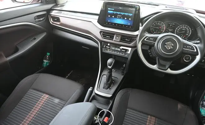 Brezza cabin also gets features like ambient lighting, Arkamys tuned sound system, auto headlamps and wireless phone charger with overheating protection Brezza cabin also gets features like ambient lighting, Arkamys tuned sound system, auto headlamps and wireless phone charger with overheating protection