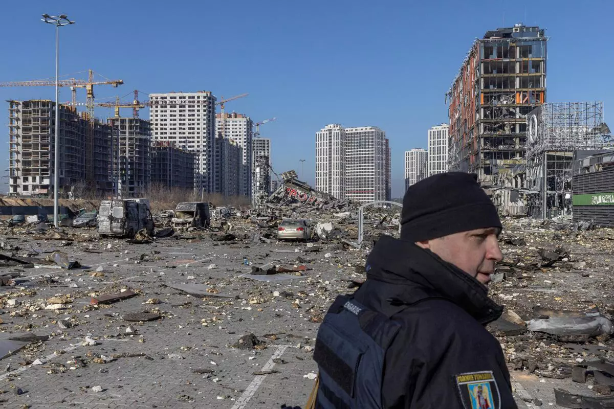 FILE PHOTO: Ukrainian serviceman secures the site of a bombing at a shopping center as Russia’s invasion of Ukraine continues, in Kyiv