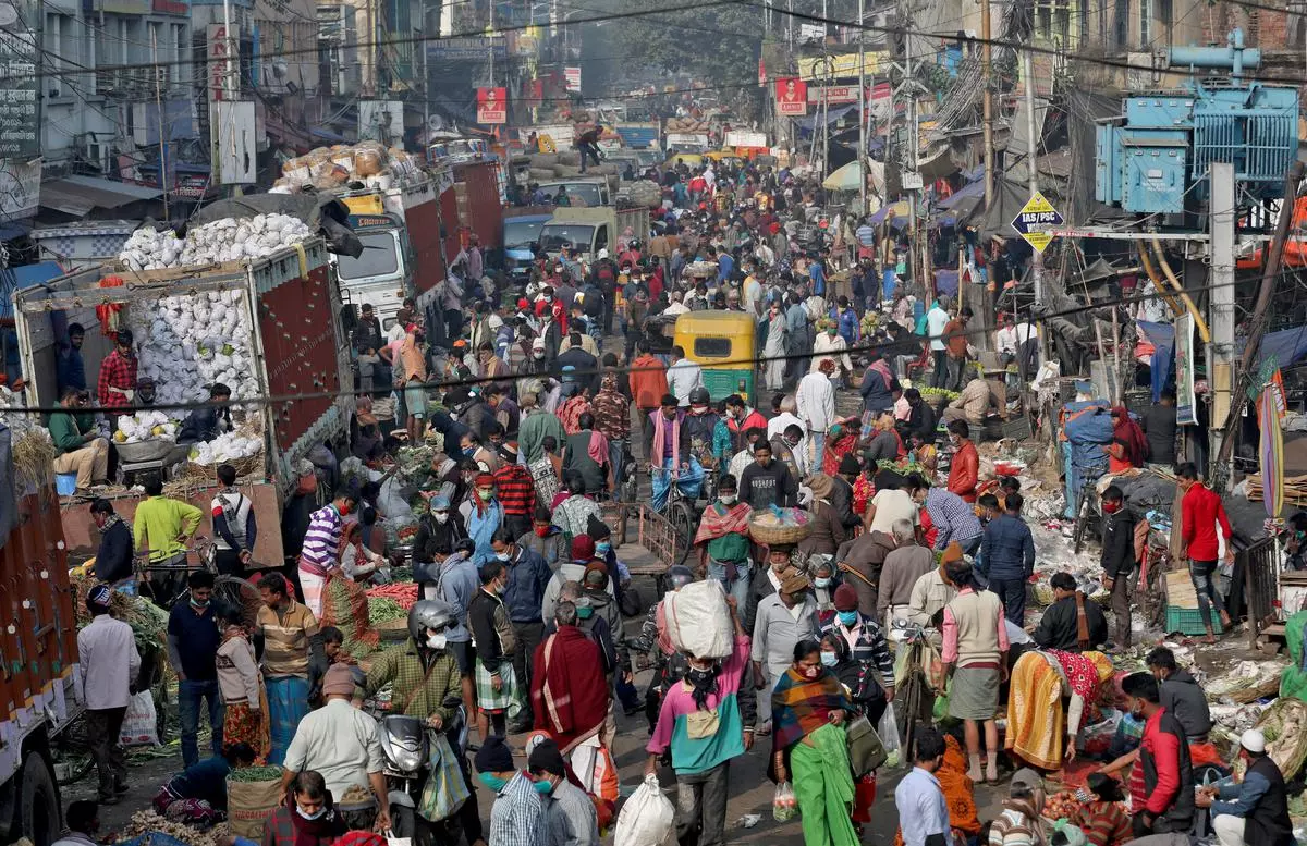 File photo of people shopping in a crowded market in Kolkata. By 2050, India would have the world’s highest population share at 16.8 per cent
