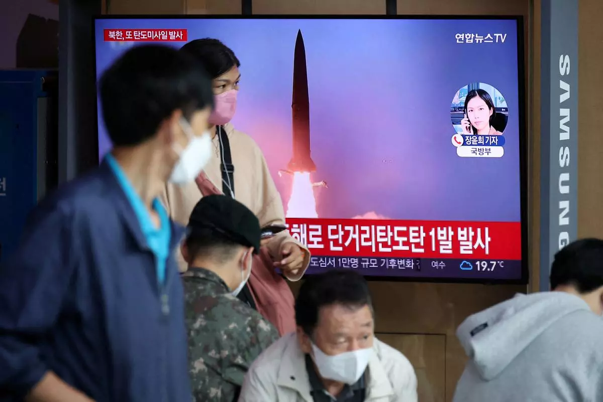 People watch a TV broadcasting a news report on North Korea firing a ballistic missile toward the sea off its east coast, in Seoul, South Korea