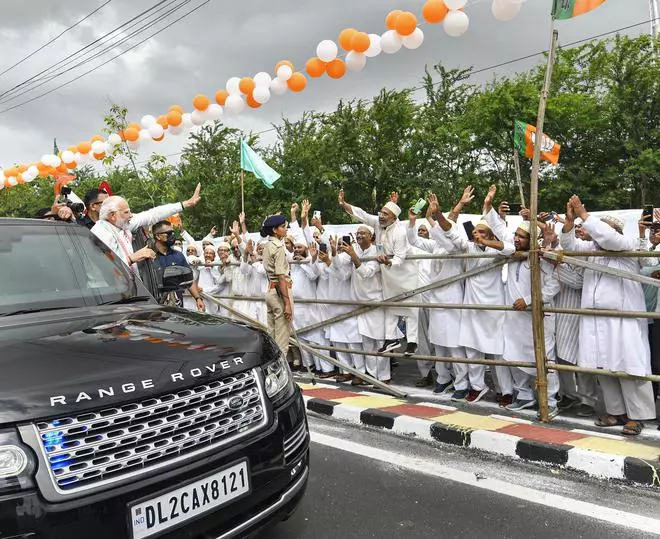 Prime Minister Narendra Modi waves at supporters in Bhuj, Gujarat, Sunday, Aug. 28, 2022. 