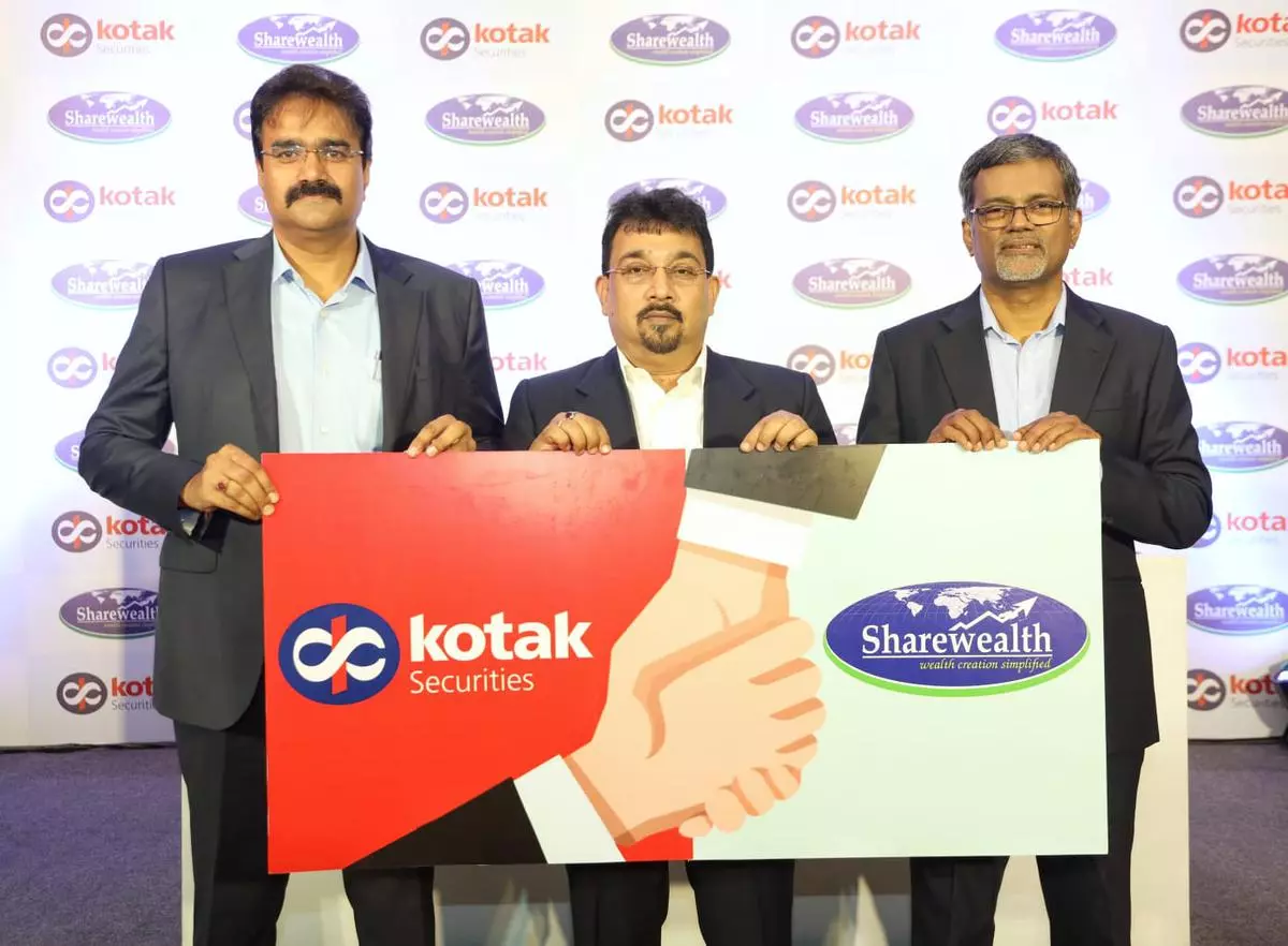 T.B., Managing Director and CEO, Sharewealth Securities (R) with Suresh Shukla (L), Joint president (Broking & Distribution), Kotak Securities and Soumitra Mukherjee, National Head, Franchise Vertical, Kotak Securities while announcing the strategic tie up in Kochi on Wednesday. 