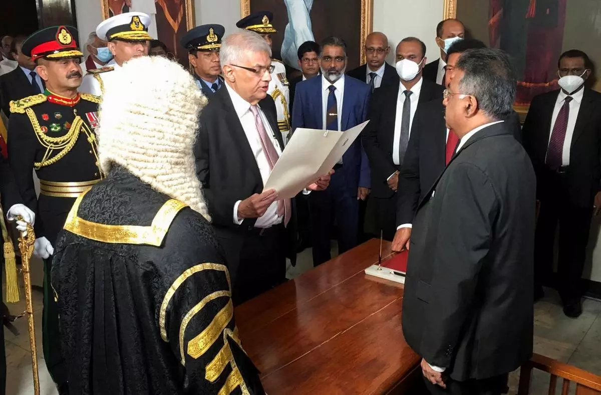 Ranil Wickremesinghe sworn in as the new president of Sri Lanka by the Chief Justice Jayantha Jayasuriya at the parliament, amid the country's economic crisis, in Colombo, Sri Lanka July 21, 2022. REUTERS/Channa Kumara