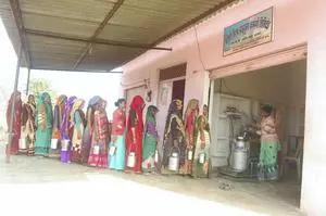 Women who are partners in the ‘Balinee Milk Producer Company Limited’ at a milk collection centre of the company, at a village in Jhansi district.