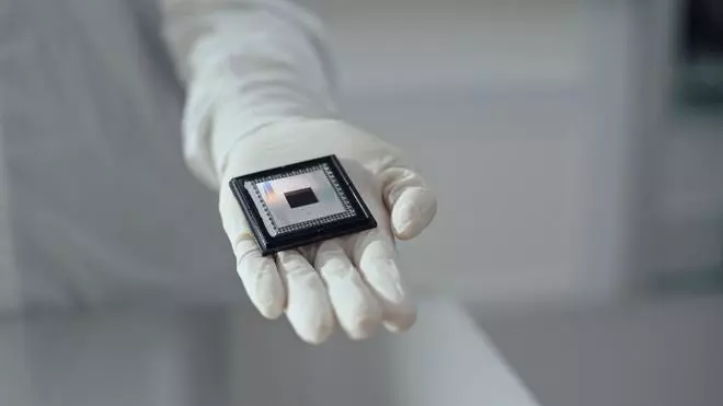 A person shows Google Quantum AI's “Willow” chip, in this undated handout photo obtained by Reuters on December 6, 2024. Google/Handout via Reuters     