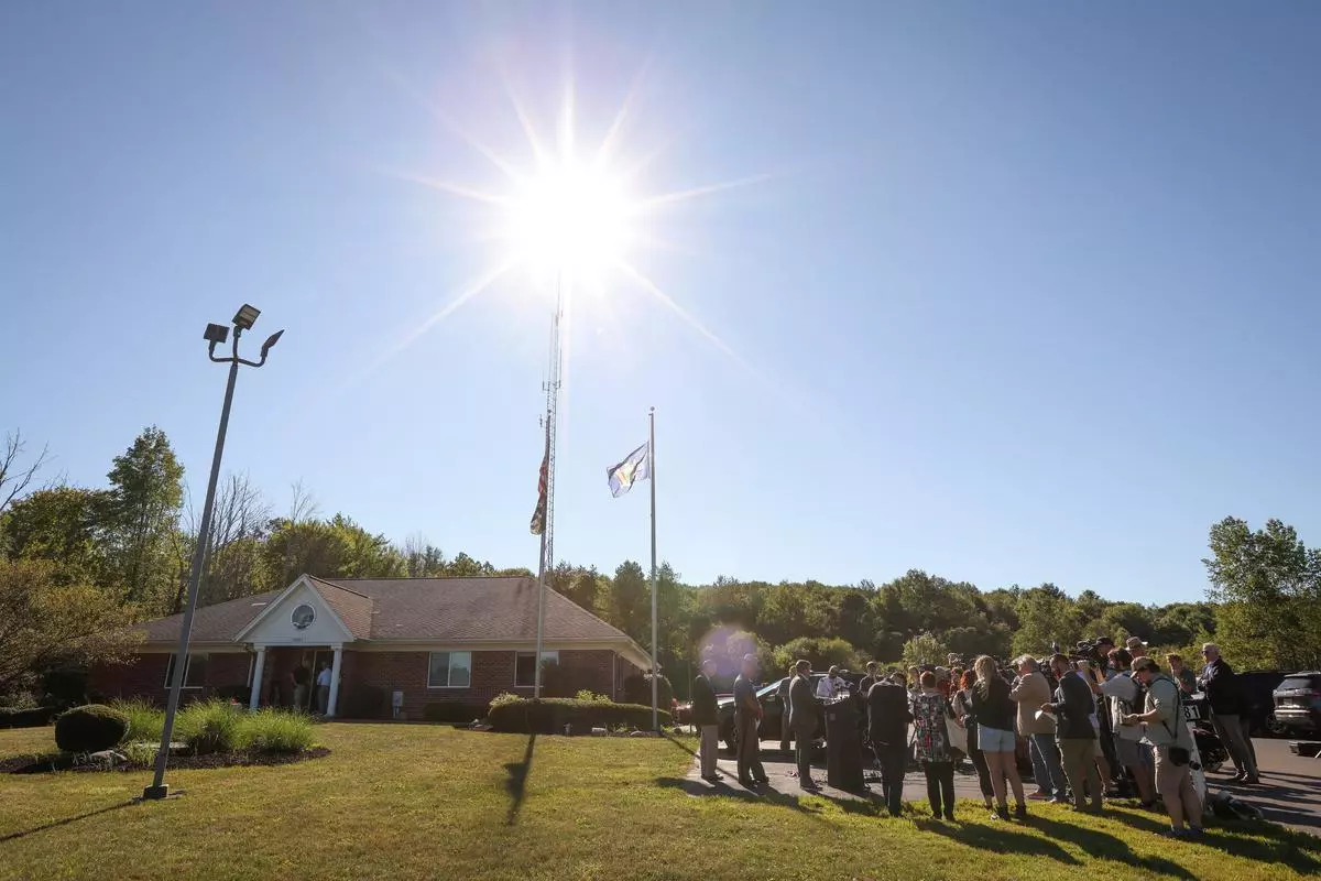 Press gather outside New York State Police Barracks in Jamestown, NY following the attack of Salman Rushdie, the Indian-born novelist who was once ordered killed by Iran in 1989 because of his writing, on stage at an event in New York, U.S., August 12, 2022.  REUTERS
