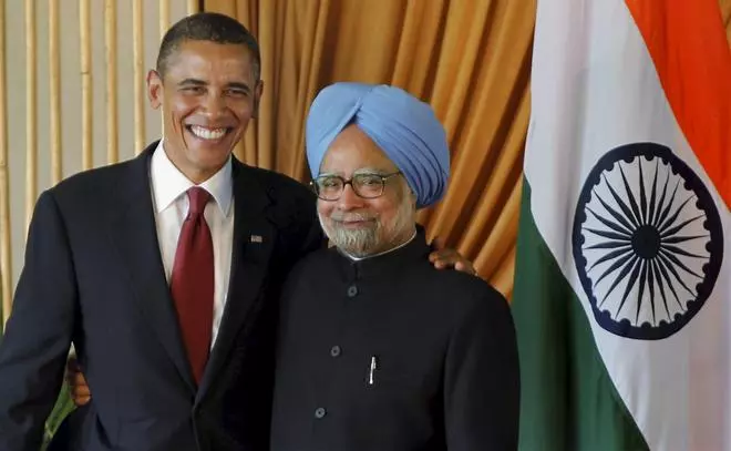 In this file image from November 8, 2010, US President Barack Obama and Prime Minister Manmohan Singh greet each other after addressing a joint press conference at Hyderabad House in New Delhi.