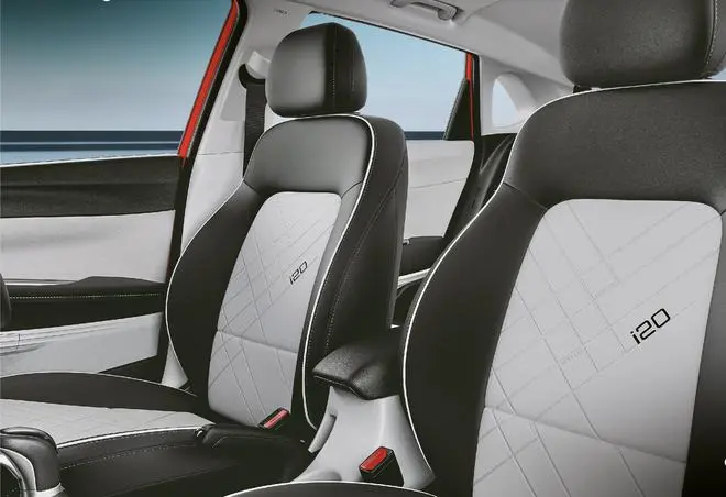 A new premium key, semi-leatherette upholstery for the seats, stitched leatherette armrests on the door panels, a new leather-wrapped flat-bottomed steering wheel etc., are some of the new features in the i20 A new premium key, semi-leatherette upholstery for the seats, stitched leatherette armrests on the door panels, a new leather-wrapped flat-bottomed steering wheel etc., are some of the new features in the i20