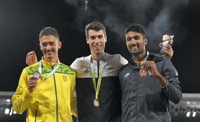 Bronze medal winner India’s Tejaswin Shankar with gold medallist New Zealand’s Hamish Kerr and silver medal winner Australia’s Brandon Starc poses for photographs after the men’s high jump event during the athletics in the Alexander Stadium at the Commonwealth Games (CWG), in Birmingham, UK, Wednesday, Aug. 3, 2022. Bronze medal winner India’s Tejaswin Shankar with gold medallist New Zealand’s Hamish Kerr and silver medal winner Australia’s Brandon Starc poses for photographs after the men’s high jump event during the athletics in the Alexander Stadium at the Commonwealth Games (CWG), in Birmingham, UK, Wednesday, Aug. 3, 2022.