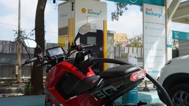 Raptee HV’s electric motorcycle T30 is described as India’s first CCS2-compliant e-two-wheeler.