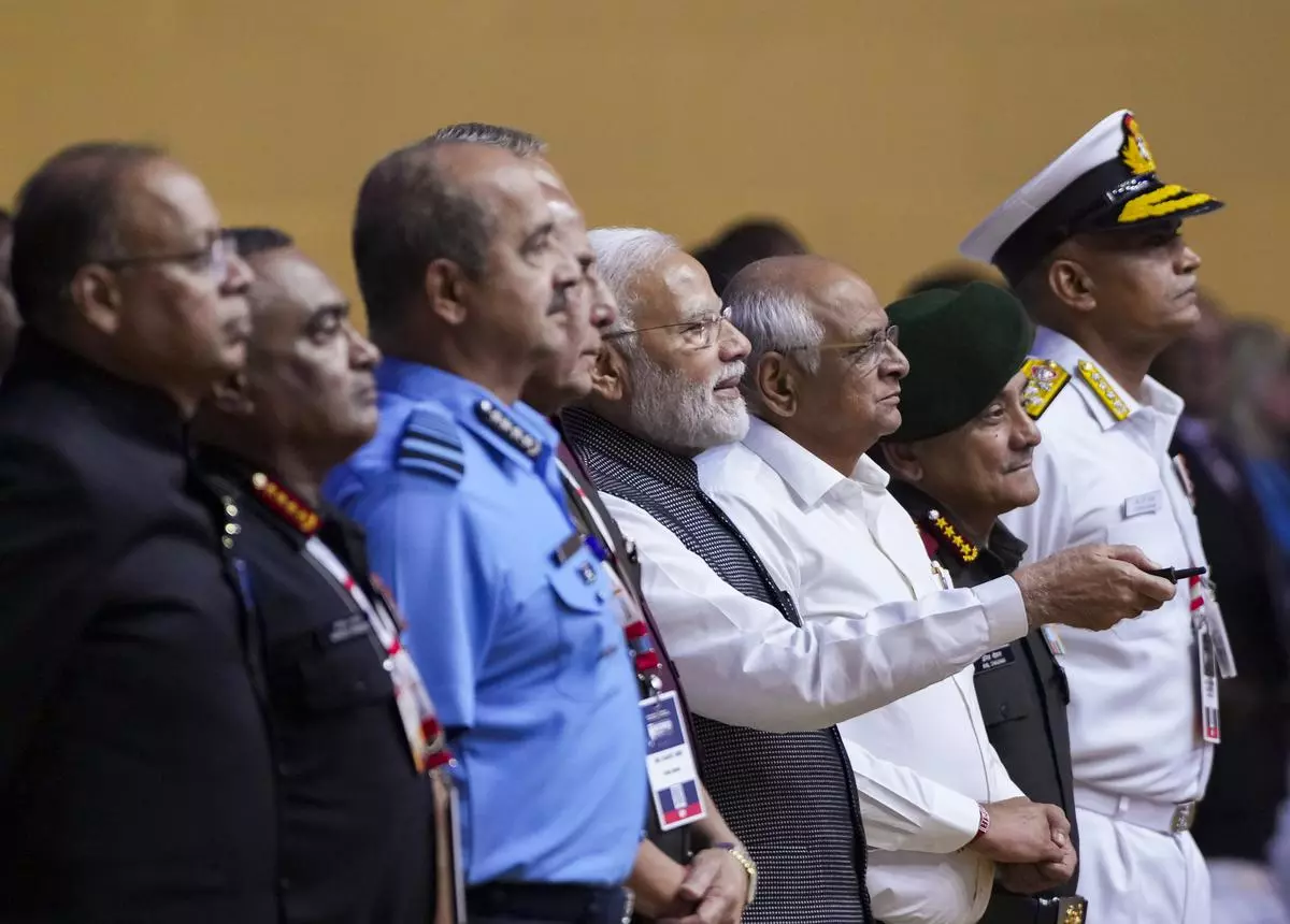 Prime Minister Narendra Modi during the inauguration of DefExpo 22, in Gandhinagar. Defence Secretary Ajay Kumar, Gujarat CM Bhupendra Patel, Chief of Defence Staff General Anil Chauhan, Chief of Air Staff Air Chief Marshal VR Chaudhari, Chief of Army Staff General Manoj Pande and Chief of Naval Staff Admiral R. Hari Kumar are also seen