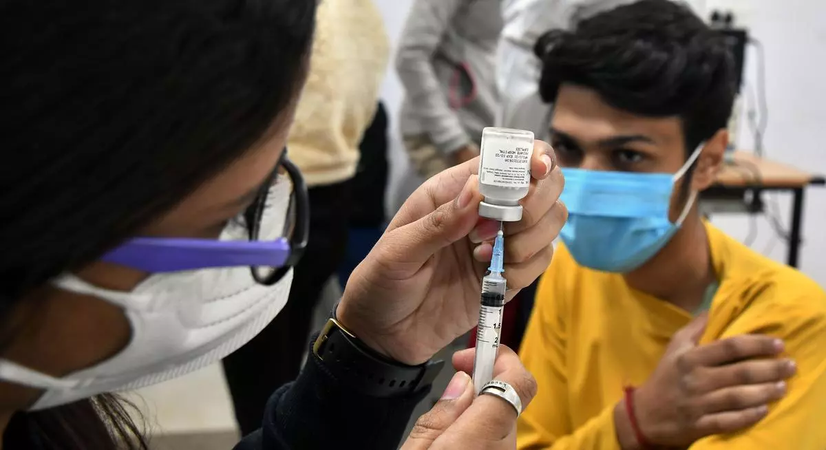 A health worker administering a shot of Covid-19 vaccine dose of Covaxin to a teenager beneficiary during the vaccination drive for 15-17 years age group, against coronavirus, at Government Sarvodya Kanya Vidyalaya Janakpuri in West Delhi on Thursday