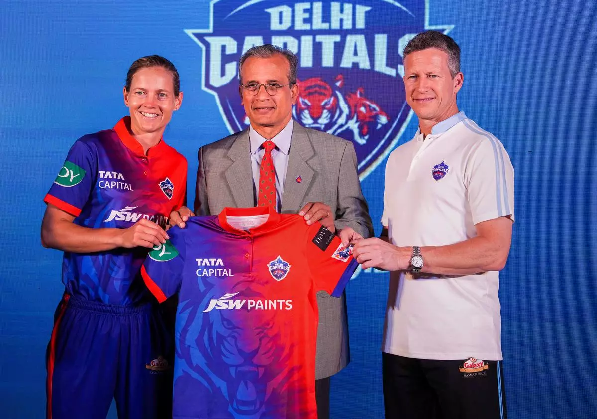Delhi Capitals women’s team captain Meg Lanning with head coach Jonathan Batty and JSW Paints Joint MD & CEO AS Sundaresan, during a press conference ahead of the WPL 2023, in Mumbai, Thursday 