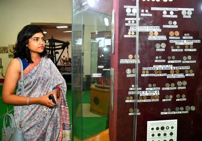 A woman looking at the exhibits after the inauguration of the Coin Museum as a part of Azadi Ka Amrit Mahotsav at Mint Compound in Hyderabad. (NAGARA GOPAL/The Hindu) A woman looking at the exhibits after the inauguration of the Coin Museum as a part of Azadi Ka Amrit Mahotsav at Mint Compound in Hyderabad. (NAGARA GOPAL/The Hindu)