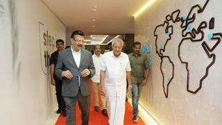 Chief Minister Pinarayi Vijayan takes a round after the launch of IBS Software’s second fully-owned campus in Infopark  Seen with him is the company’s Founder & Executive Chairman V K Mathews.