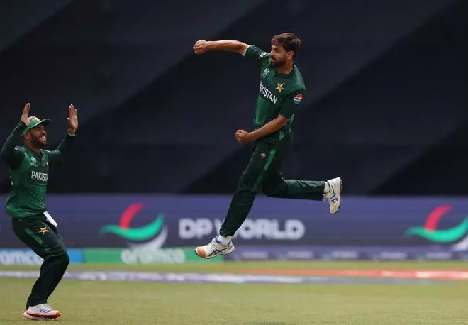 Pakistan’s Haris Rauf celebrates with Usman Khan after taking the wicket of India’s Jasprit Bumrah.