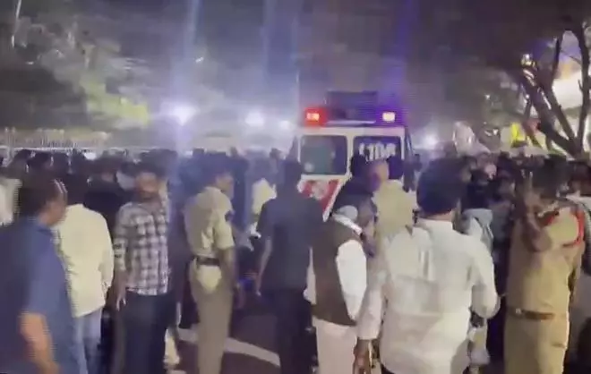 Police personnel and people gather after a stampede broke out as hundreds of devotees jostled for tickets for Vaikunta Dwara Darshanam at Lord Venkateswara Swamy temple on Tirumala Hills, in Tirupati, Andhra Pradesh, Wednesday, Jan. 8, 2025.  