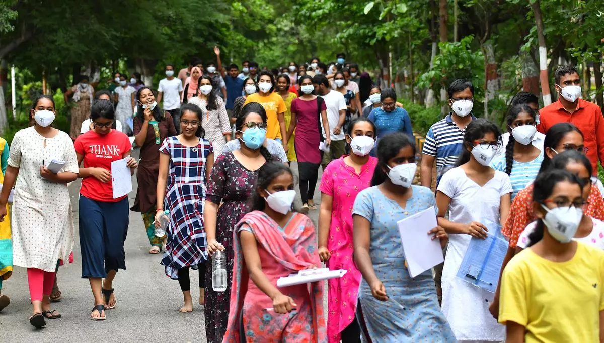 File photo of Medical aspirants walking out of a centre after appearing for the National Eligibility cum Entrance Test, Undergraduate (NEET-UG)-2022 in Hyderabad.