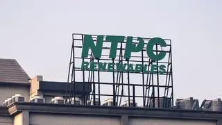 File photo: Signage for NTPC Renewable Energy Ltd., a unit of NTPC Ltd.’s NTPC Green Energy Ltd., atop a building in Greater Noida, Uttar Pradesh, India.