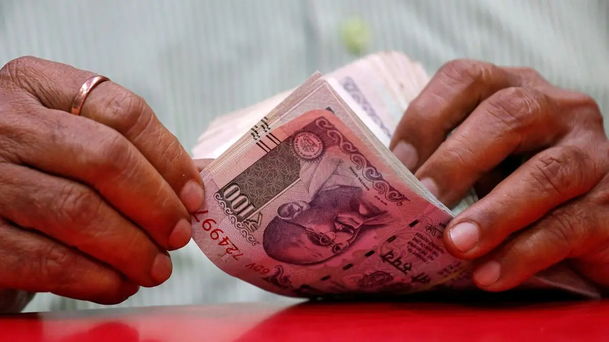 Rupee declined to close at a record low of 87.58