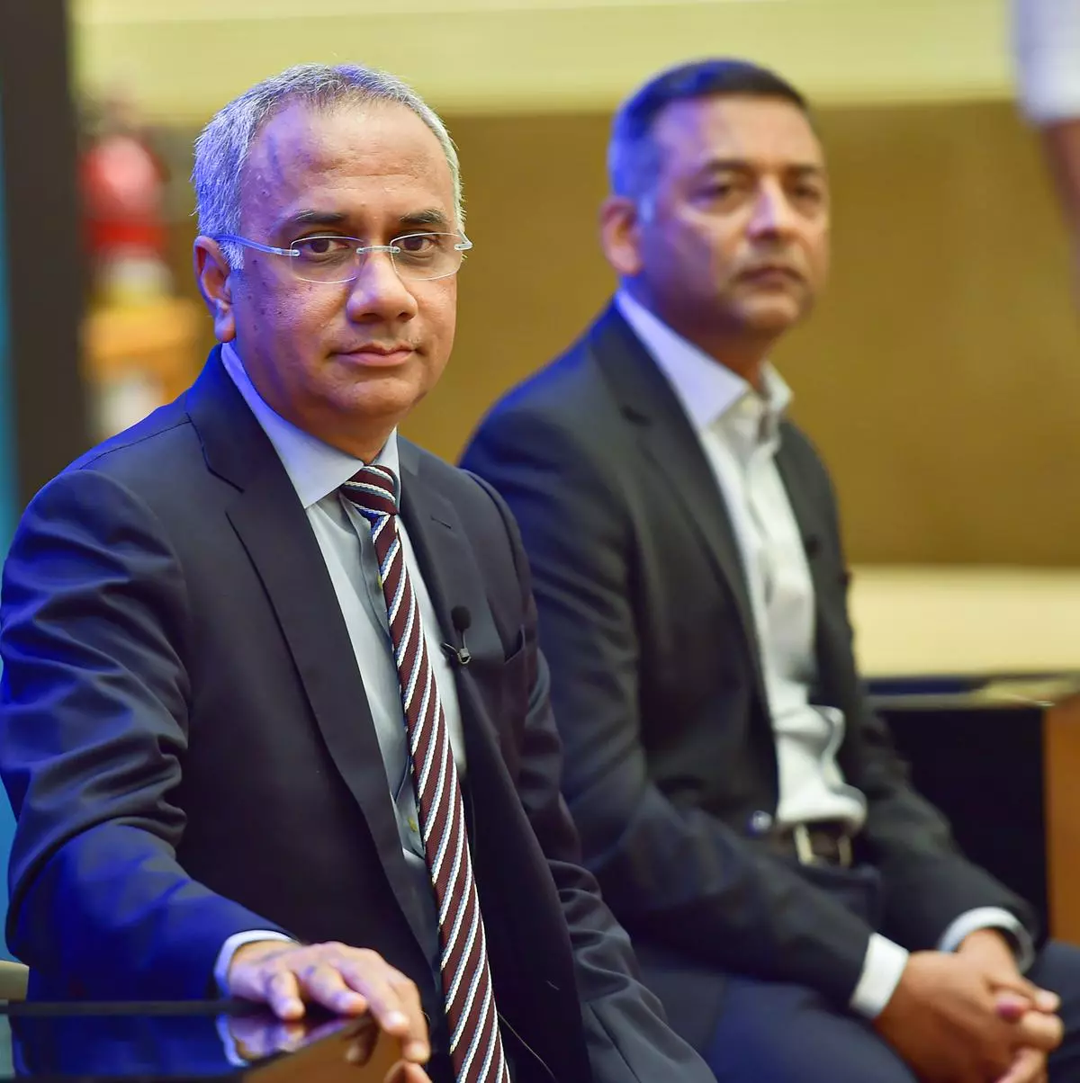 Infosys CEO & MD Salil Parekh (L) with CFO Nilanjoy Roy during a press conference to announce the annual financial results of the company at its headquarter in Bengaluru, on Wednesday