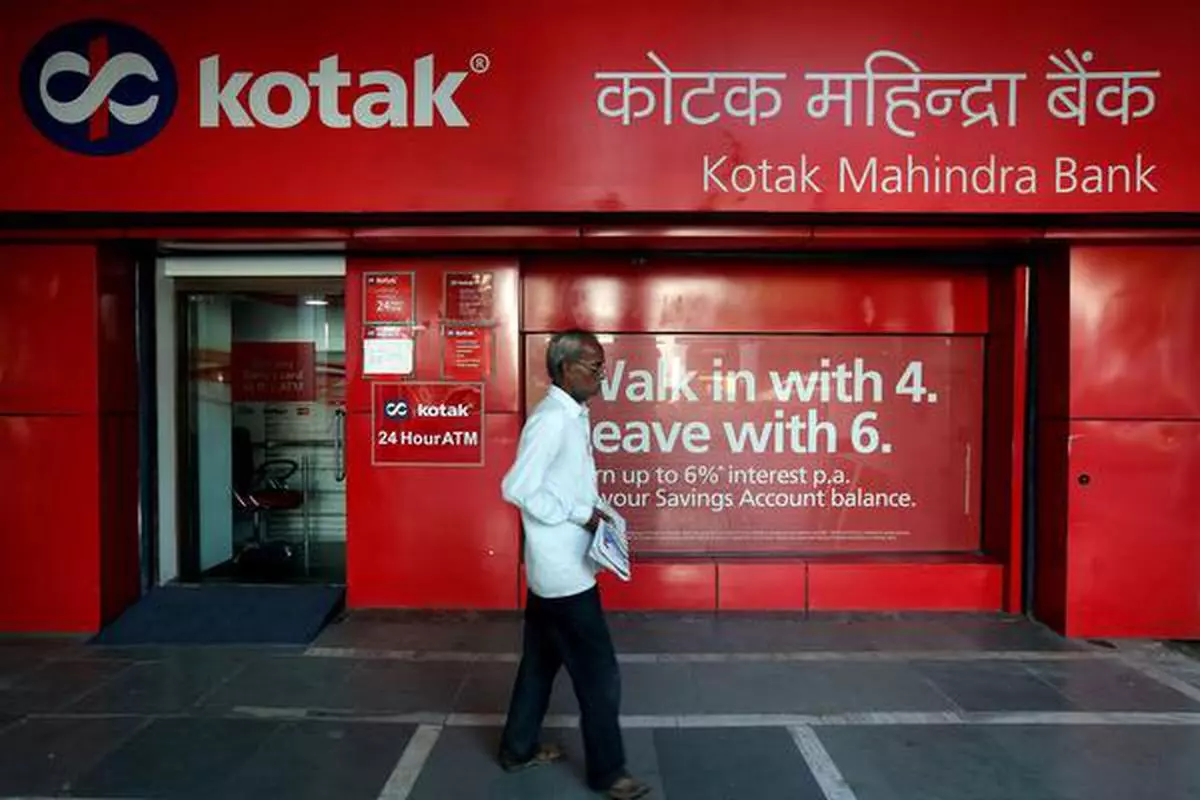 FILE PHOTO - A man walks past the Kotak Mahindra Bank branch in New Delhi, India, September 6, 2017. REUTERS/Adnan Abidi/File Photo