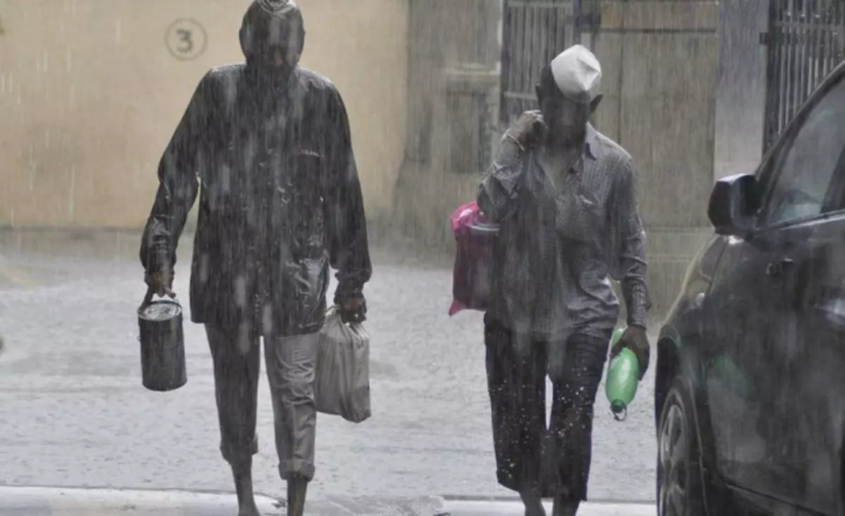 Mumbai's famous 'Dabbawalas' carrying lunch boxes to deliver home-cooked meals to office-goers in Mumbai even during heavy rains, in this recent file photo. -- Photo: Shashi Ashiwal