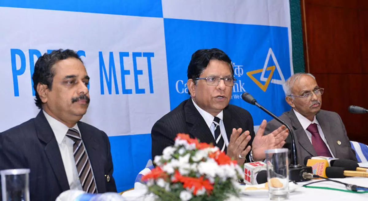 R. K. Dubey, CMD, Canara Bank, addressing news persons in Thiruvananthapuram on Tuesday. G. Sreeram (left), General Manager, Kerala Circle and K. S. Prabhakar Rao, General Manager, Head Office, are also seen. — Special Arrangement