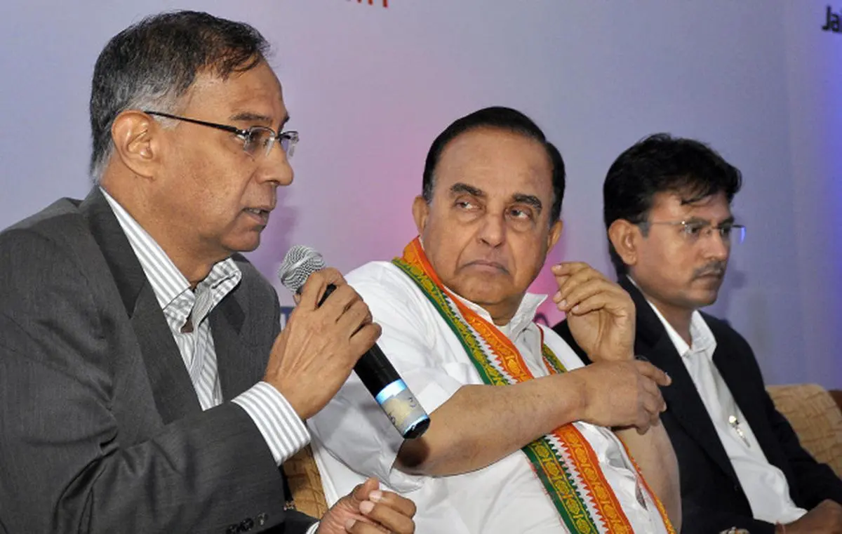 Growth worries: (From left) R. Seshasayee, Vice-Chairman, Ashok Leyland; Subramanian Swamy, BJP Leader; and Nilesh Shah, President-Investment Banking, Axis Bank, at a session on ‘Current state of Indian Economy : Gloom, Doom or Boom?', organised by Jain International Trade Organisation- Chennai Chapter, in Chennai on Sunday. — Bijoy Ghosh