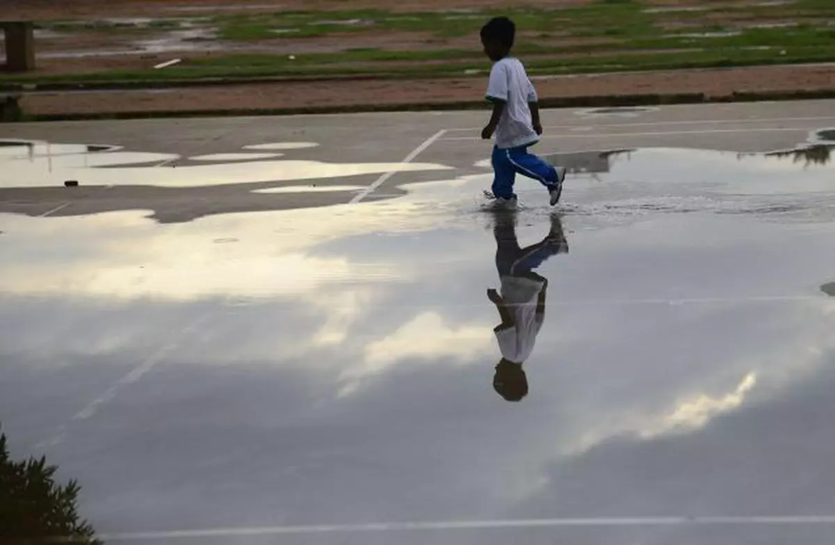 A boy enjoying in the  stagnated rain water inside the  Nehru Park  on Sunday.  Photo: M. Vedhan
