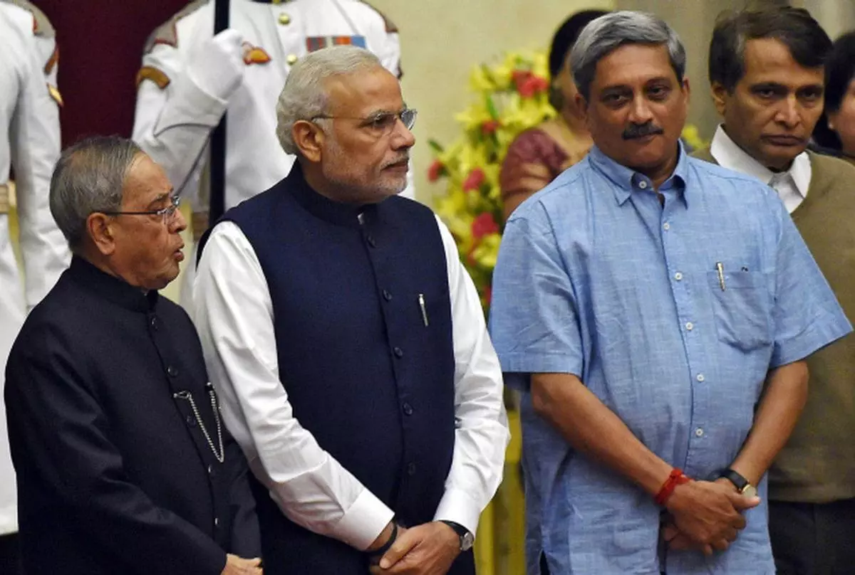 Coming on board (From left) President Pranab Mukherjee, Prime Minister Narendra Modi, new CabinetMinisters Manohar Parrikar and Suresh Prabhu during the swearing-in ceremony in New Delhi on Sunday. REUTERS