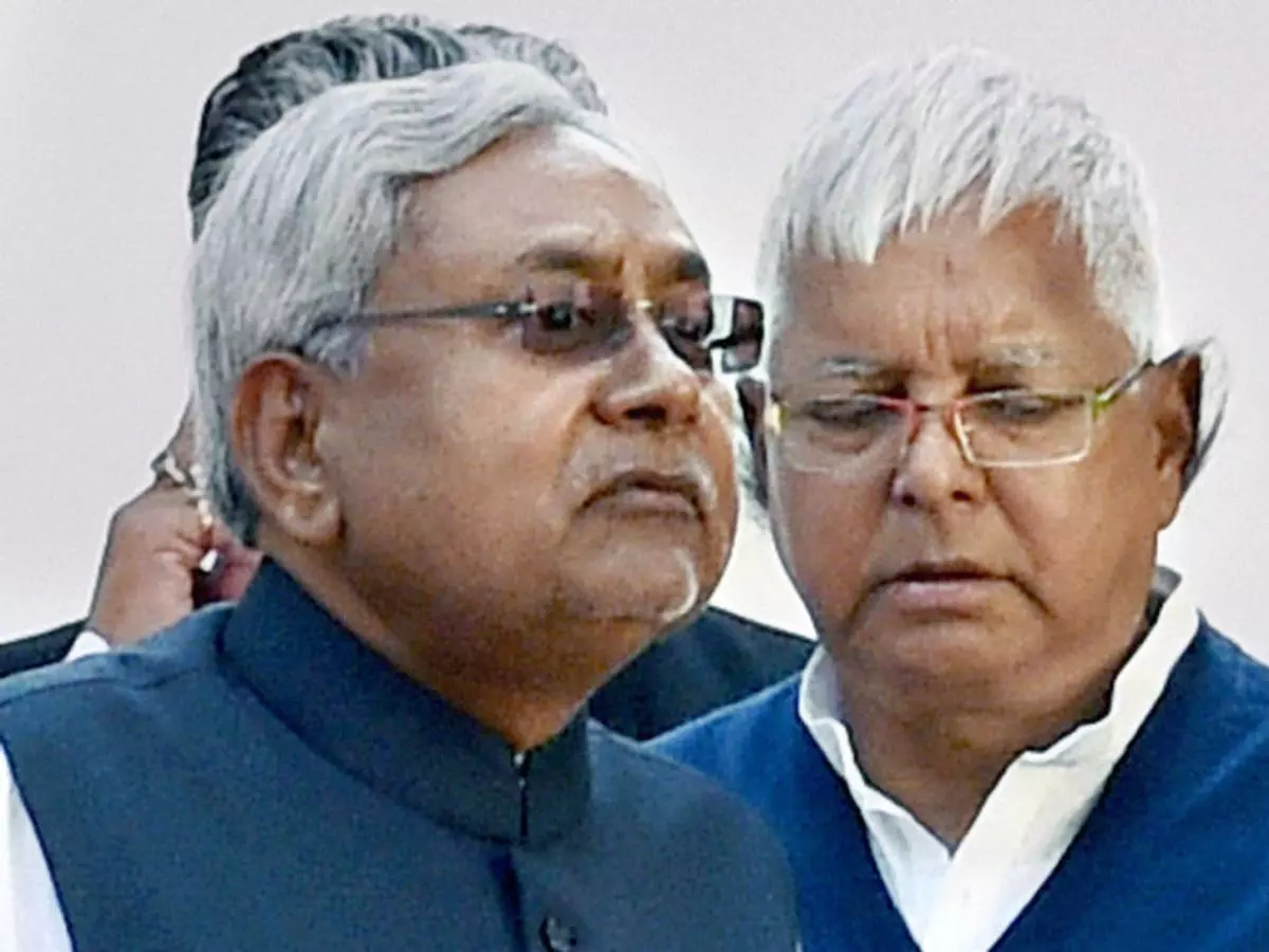 Tough competition JD(U) leader Nitish Kumar and RJD chief Lalu Prasad (file photo). The two have teamed up with SP leader Mulayam Singh and others to form a combined socialist front