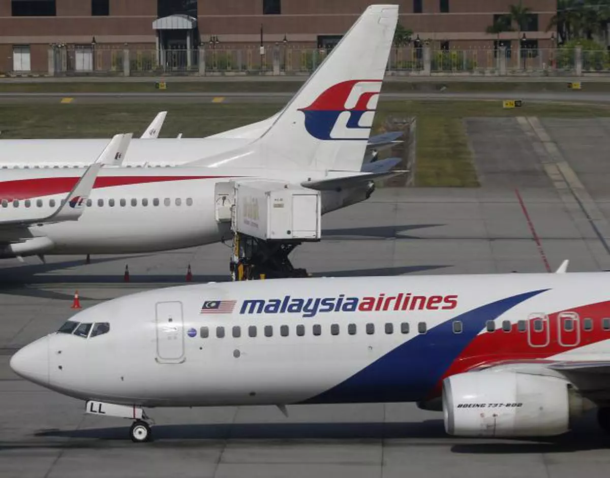 Malaysia Airlines planes are pictured at Kuala Lumpur International Airport in Sepang July 18, 2014. Malaysian Airlines System Bhd (MAS) shares fell sharply on Friday on news one of its planes was downed in Ukraine, raising pressure on the state-run carrier to try to restore investor confidence after the second major disaster in months. REUTERS/Olivia Harris   (MALAYSIA - Tags: BUSINESS TRANSPORT)