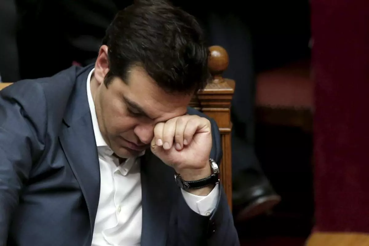 Greek Prime Minister Alexis Tsipras reacts during a parliamentary session in Athens, Greece July 16, 2015. The Greek parliament passed a sweeping package of austerity measures demanded by European partners as the price for opening talks on a multi-billion euro bailout package needed to keep the near-bankrupt country in the euro zone.