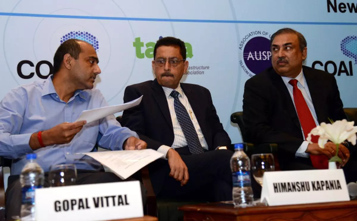 Looking for a solution Telecom Industry representatives (from left) Gopal Vittal,  MD and CEO (India and South Asia), Bharti Airtel; Himanshu Kapania, Managing Director, Idea Cellular; and  Sinil Sood, Managing Director, Vodafone India, at a press conference in New Delhi, on Monday V SUDERSHAN