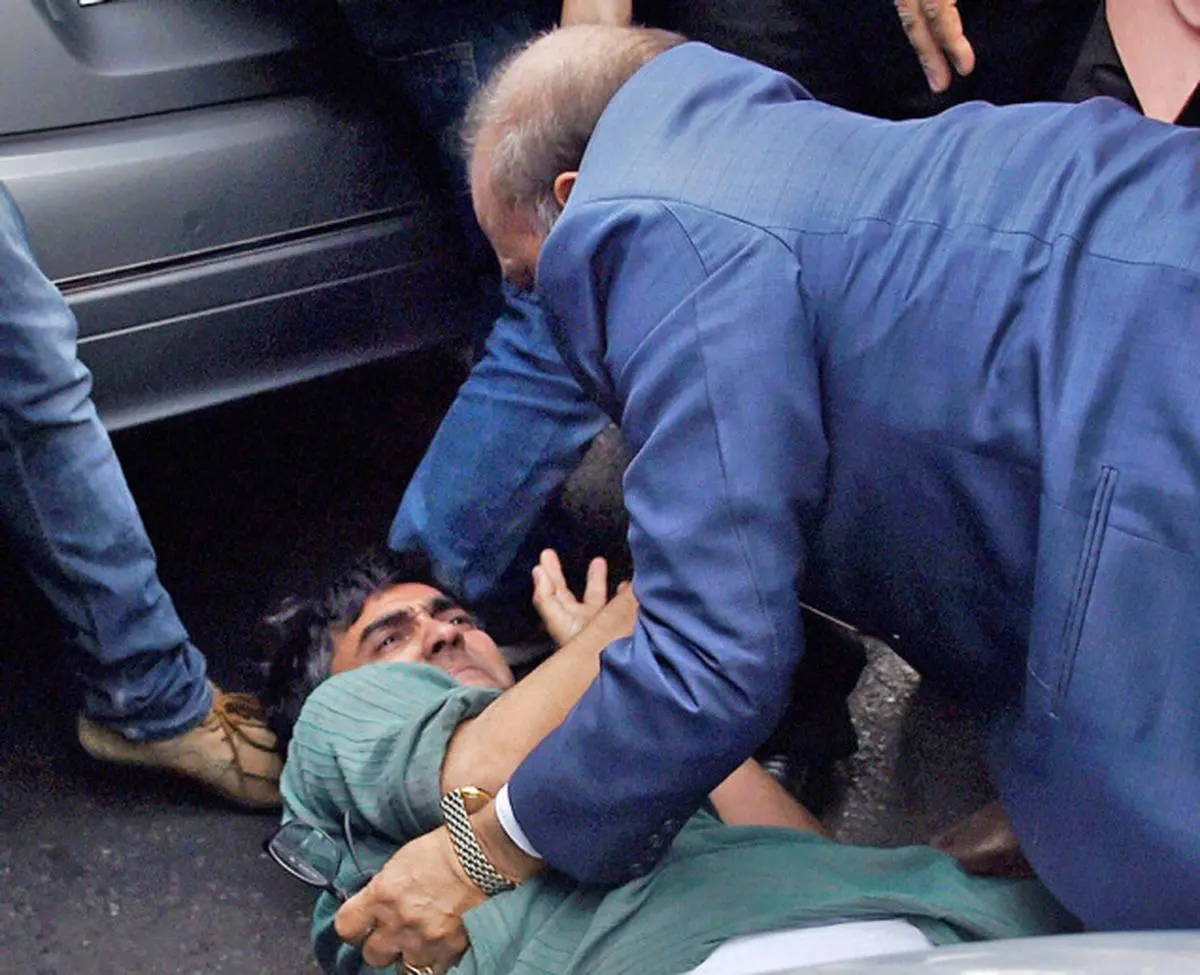 BJP’s Delhi MLA OP Sharma thrashes a student protesting against the arrest of  JNU Students’ Union President Kanhaiya Kumar outside the Patiala House Courts in New Delhi on Monday.  PTI