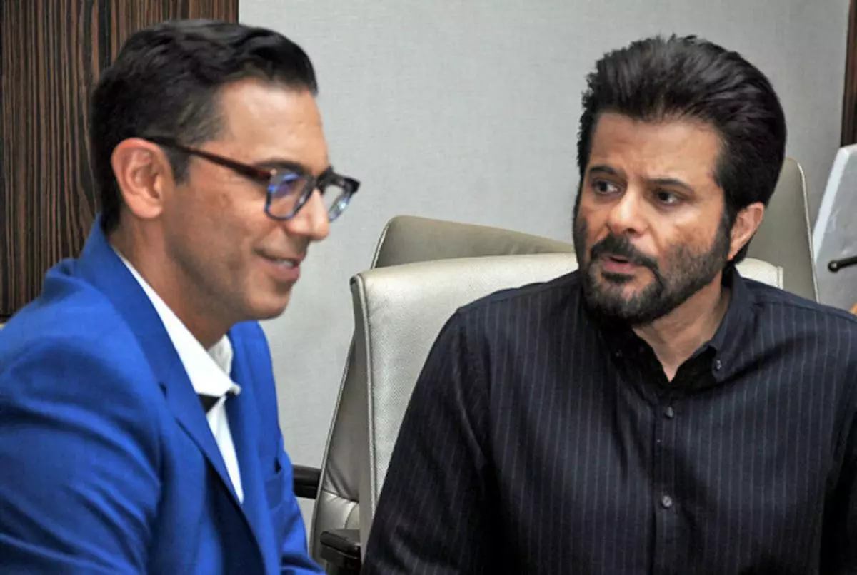 New role Indi.com founder Neel Grover with Anil Kapoor in Mumbai on Monday. Kapoor has invested in Indi.com, and is also its brand ambassador PAUL NORONHA
