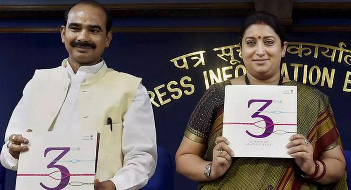 Three cheers  Union Textiles Minister Smriti Irani and MoS Ajay Tamta releasing a booklet on the key initiatives taken by the Ministry over the past three years, in New Delhi on Monday