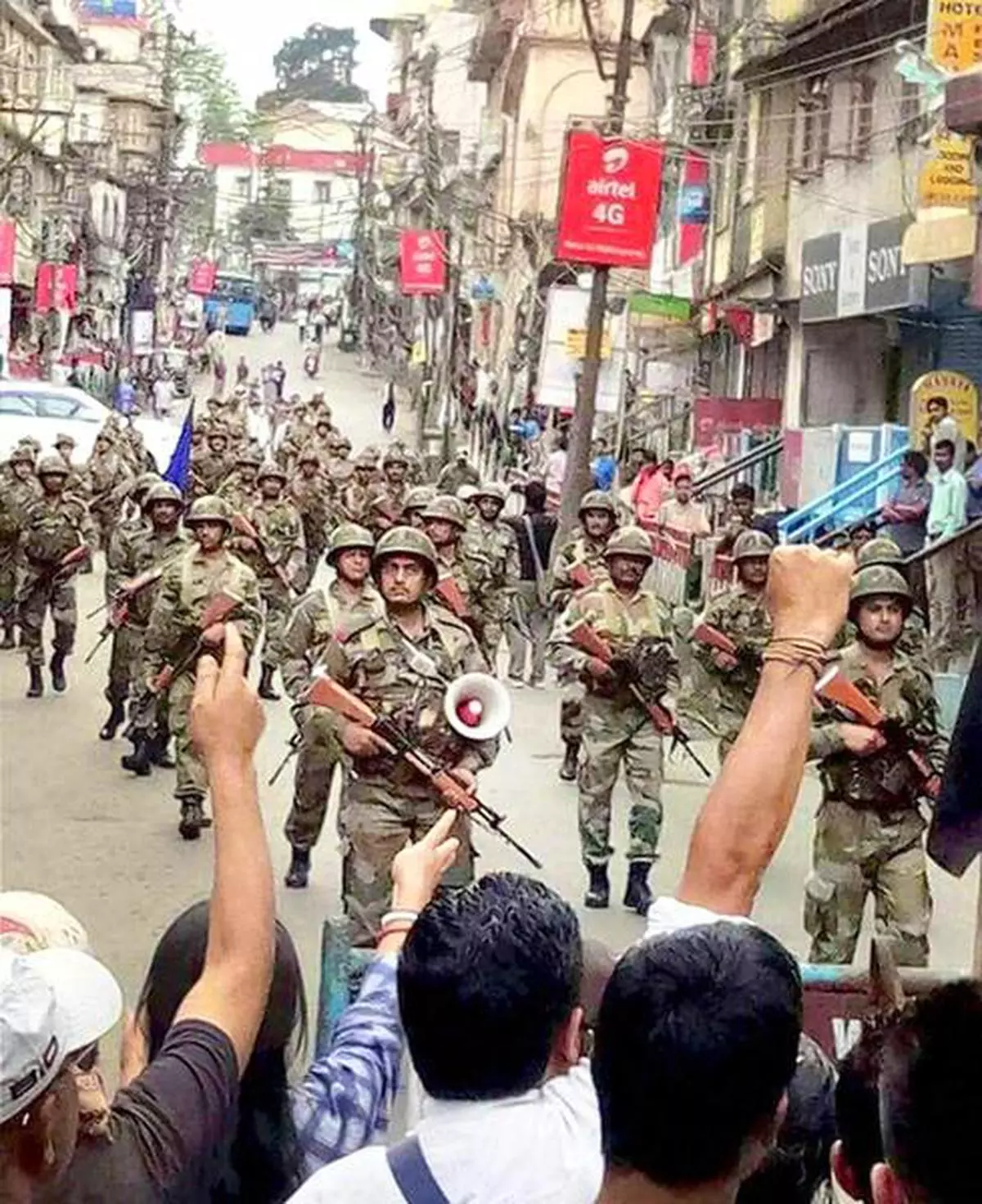 CRPF troops patrol the streets, a day after supporters of the Gorkha Janmukti Morcha (GJM) resorted to violence