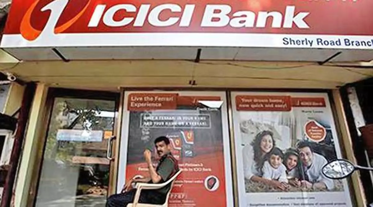 A security guard sits outside an ICICI bank branch in Mumbai, India, April 4, 2018. REUTERS/Francis Mascarenhas