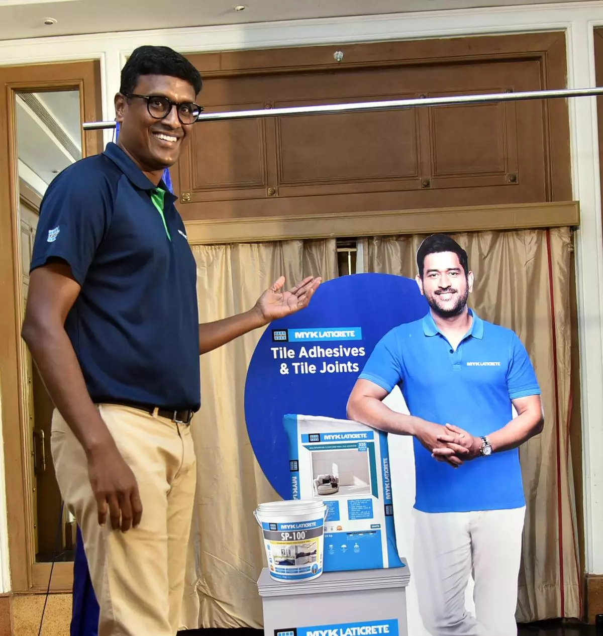 Murali Yadama, Managing Director of MYK Laticrete with a cut-out of cricketer M S Dhoni 