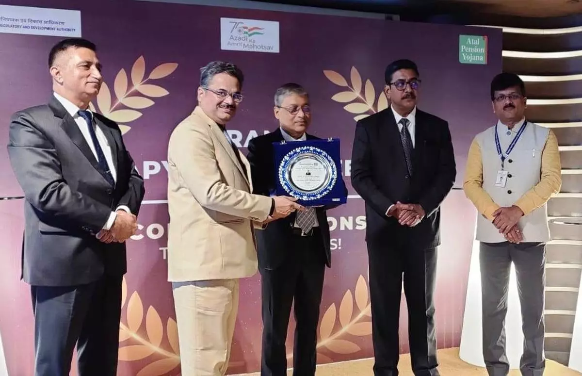 P Gopi Krishna (second from left), Chairman of KVG Bank, receiving the national award from Pension Fund regulatory and Development Authority (PFRDA) for significant enrolment under Atal Pension Yojana (APY) in New Delhi on Monday 