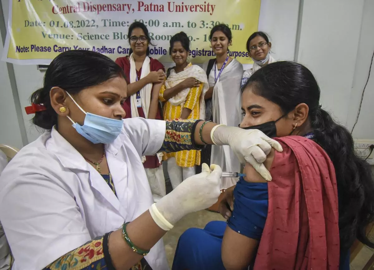 A healthcare worker administers a dose of Covid-19 preventive vaccine to a student at a vaccination camp in Patna Women’s College, Monday, August 1, 2022. (PTI)