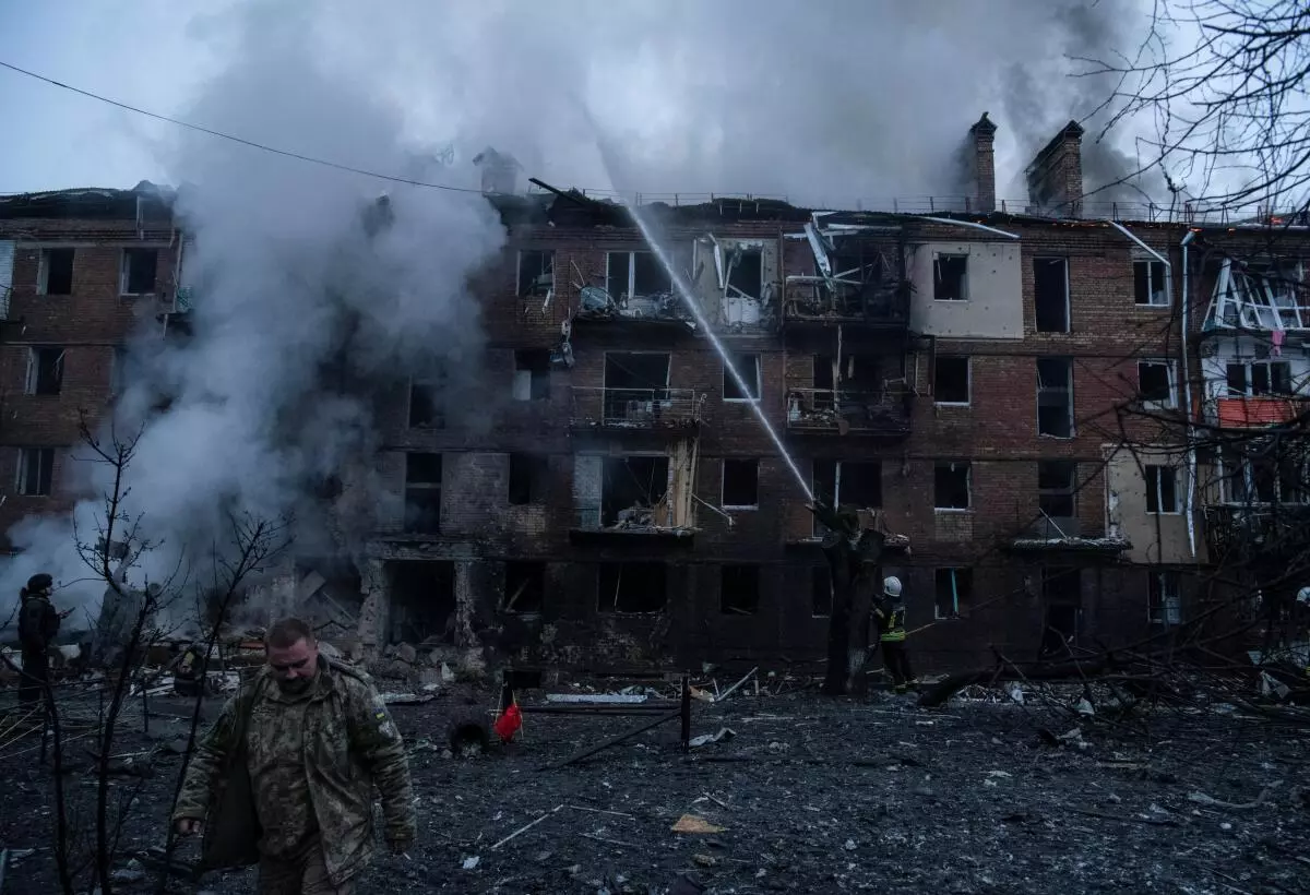 Rescuers work at a site of a residential building destroyed by a Russian missile attack, as Russia’s attack on Ukraine continues, in the town of Vyshhorod, near Kyiv, Ukraine, November 23, 2022. REUTERS