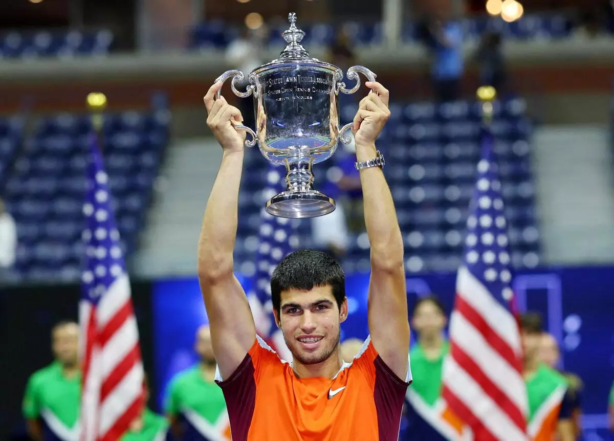 Spain’s Carlos Alcaraz celebrates with the trophy after winning the US Open. REUTERS